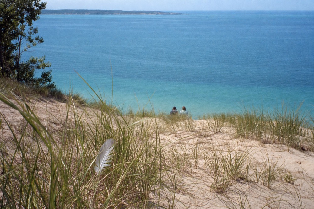 Overlook above Lake Michigan with dunes and blue water stretching to the horizon