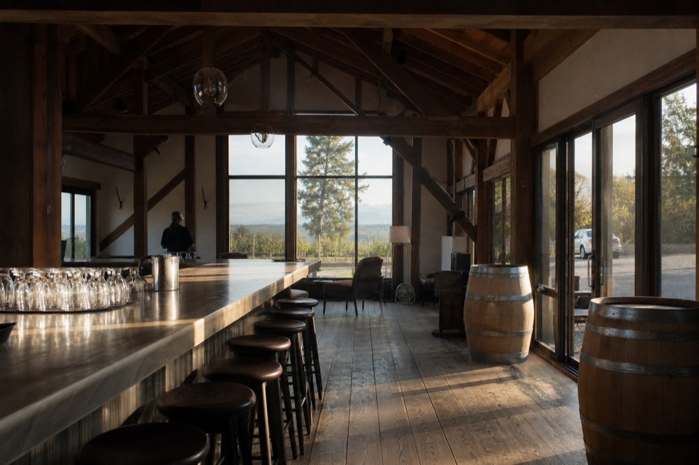 Empty tasting bar with stools and glasses waiting before opening