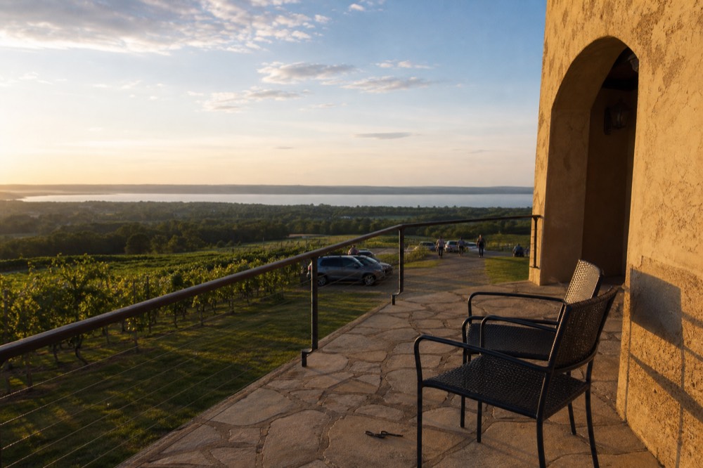 A hilltop winery terrace overlooking East Grand Traverse Bay