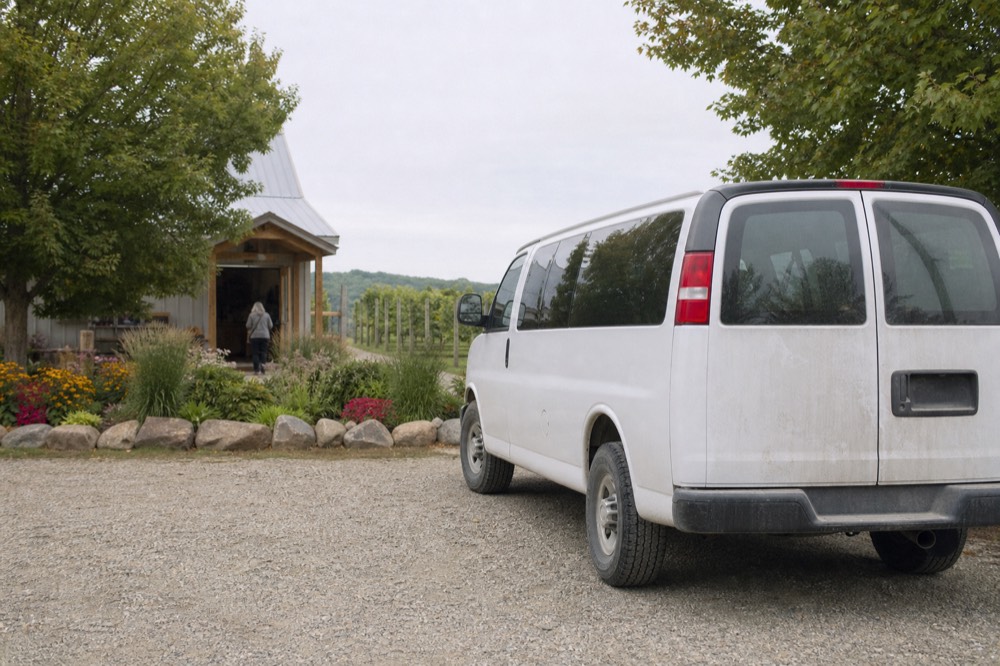 A shuttle van parked outside a winery tasting room on Old Mission Peninsula