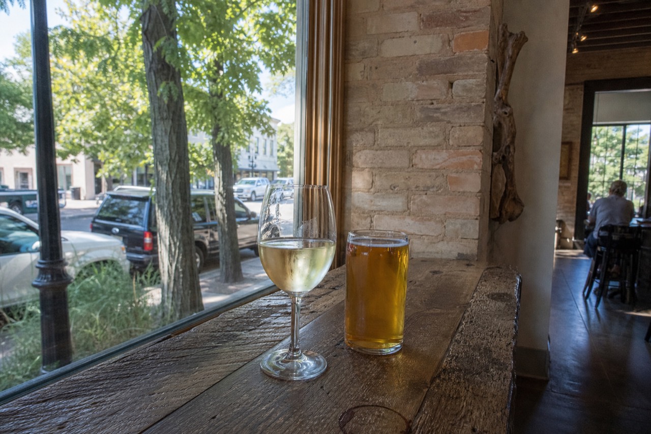 Glasses of wine and beer on a tasting room counter in Traverse City