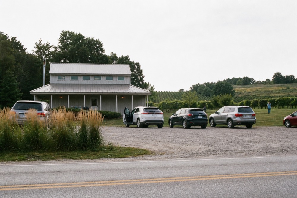 Bicycles parked outside a small winery building on a peninsula road